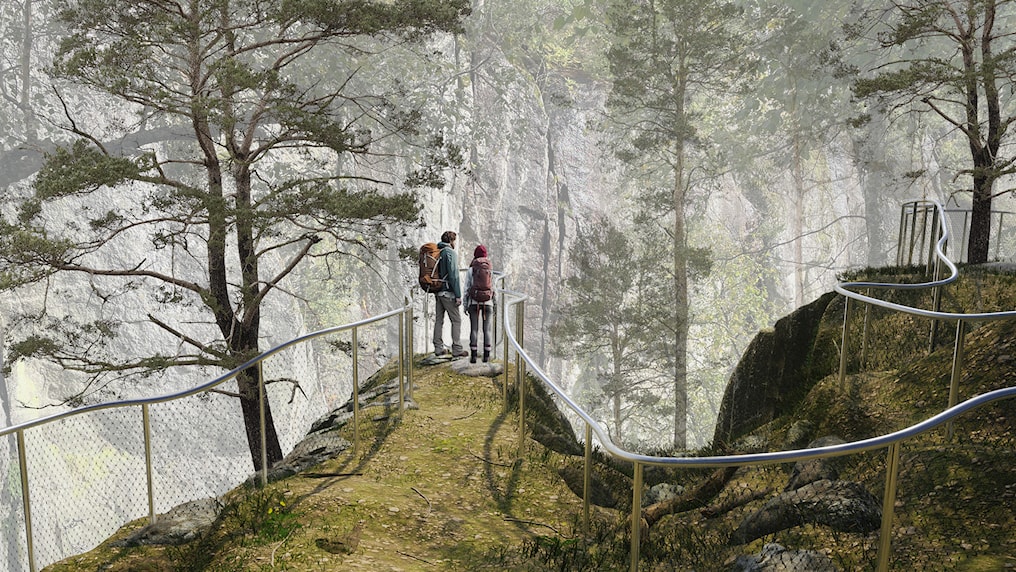 Woman and man standing next to the railing at a viewpoint.
