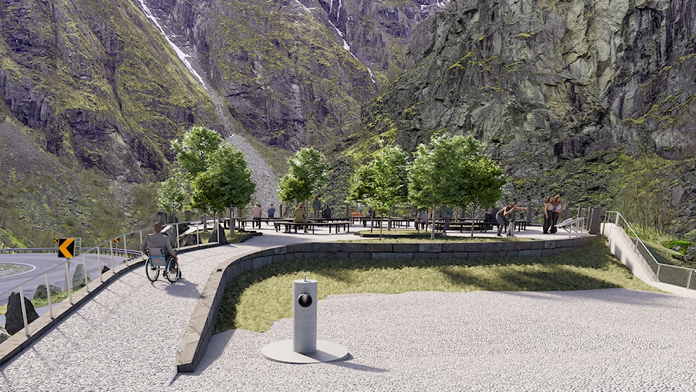 Rest area with benches and trees. Man in a wheelchair drives into the area.