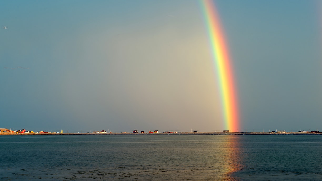 Midnattsol og regnbue
